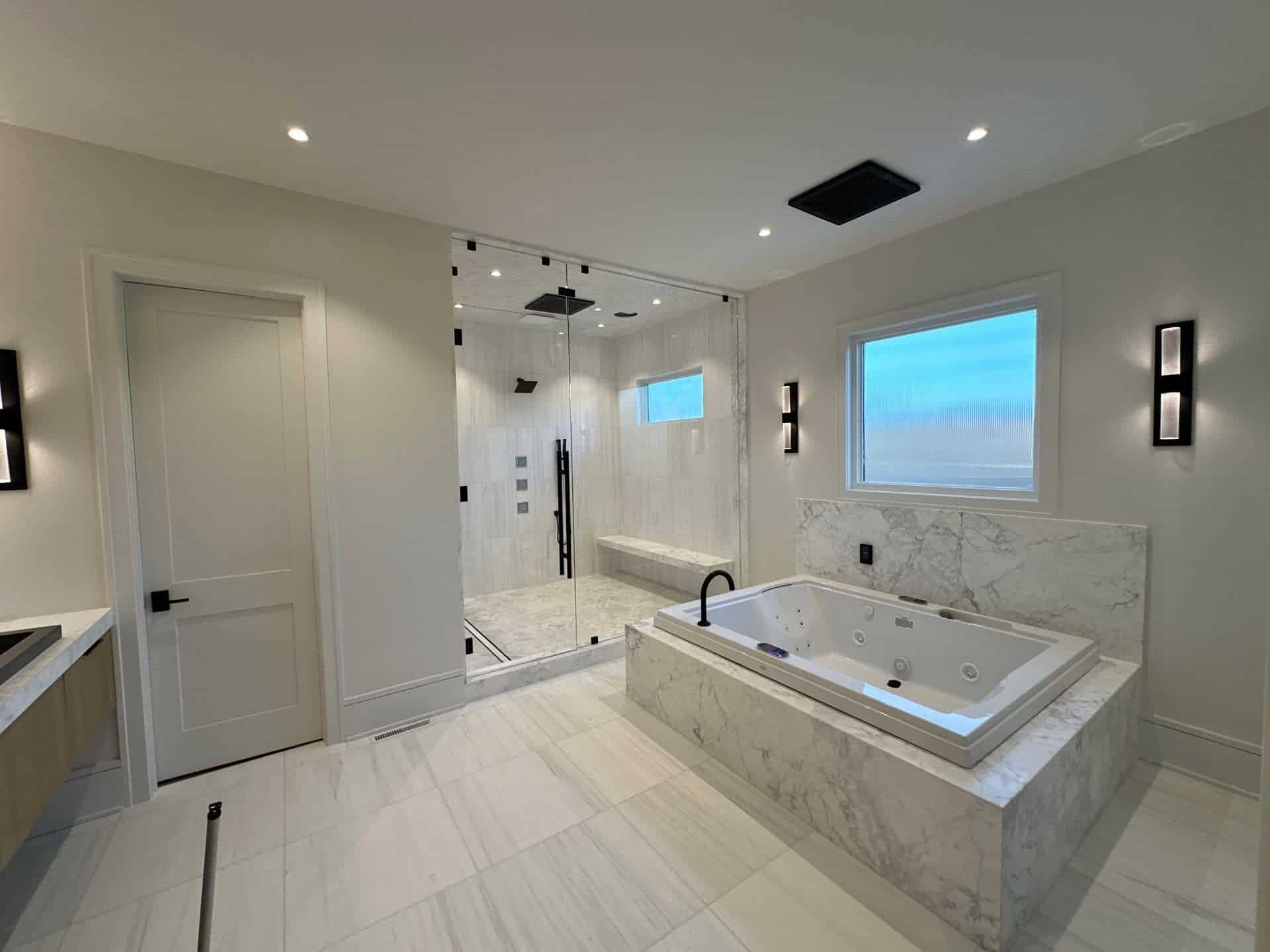 A large white bathroom with a bathtub and a shower