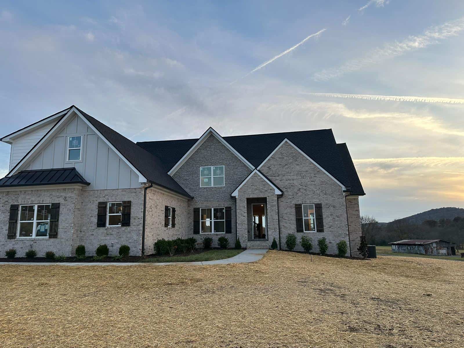 A wider view of the exterior of a modern brick house